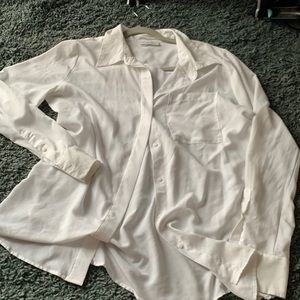 Chiffon type white button down. Slightly opaque.